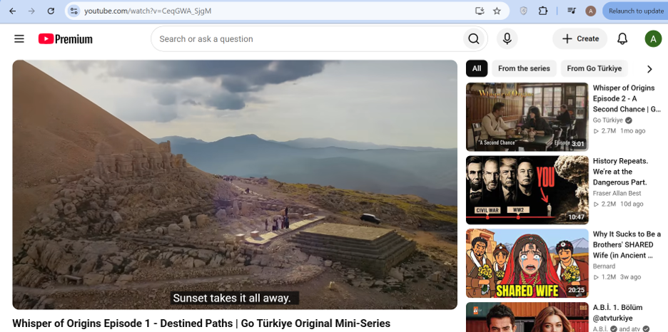 Wide landscape view of an archaeological site and mountains in southeastern Türkiye in Whisper of Origins, with the English subtitle “Sunset takes it all away.”